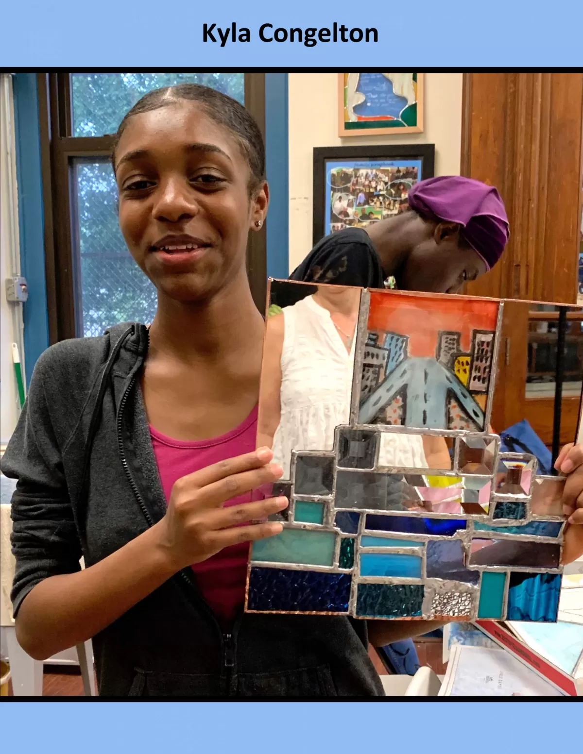Kyla with her project - Photo Credit: The Stained Glass Project